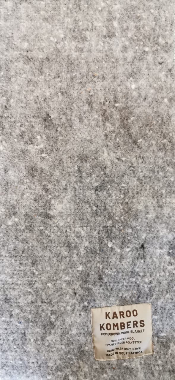 Textile with a label on a textured gray background